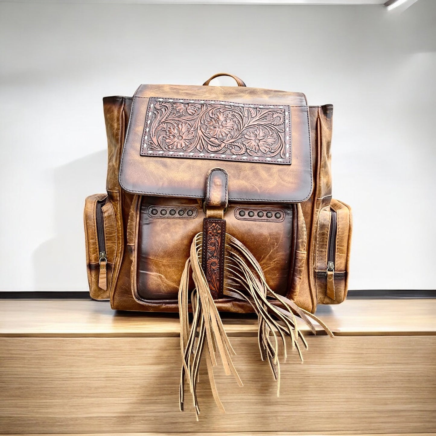 Tooled leather fringe backpack